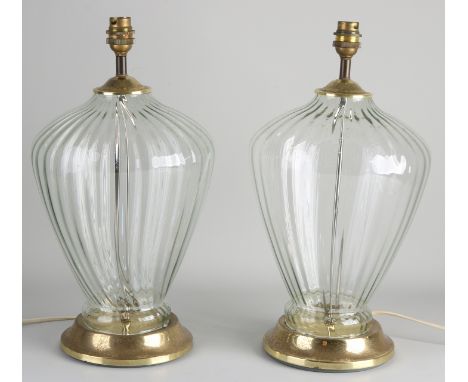 Two brass with glass table lamp bases.&nbsp;Second half of the 20th century.&nbsp;Dimensions: H 40 cm.&nbsp;In good condition