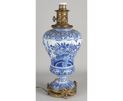 19th Century Delft Fayence lamp base with brass.&nbsp;Chinoiserie / landscape / bird decor.&nbsp;Dimensions: H 46 cm.&nbsp;In