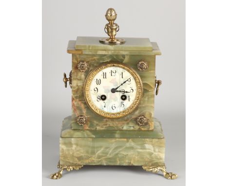 Antique French onyx mantel clock with brass.&nbsp;Eight-day movement, half-hour strike, spring pendulum.&nbsp;Size: 32 cm.&nb