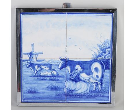 4-Pas Delft tile tableau.&nbsp;19th century.&nbsp;Farmer's wife milks a cow.&nbsp;Size: 30 x 30 cm.&nbsp;In good condition.