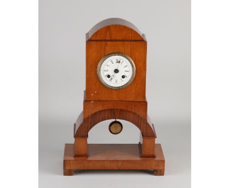 German walnut Biedermeier style mantel clock.&nbsp;Circa 1900. Eight-day movement, half-hour strike, spring pendulum.&nbsp;Si