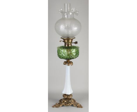 Antique monogrammed kerosene lamp with brass base, solid glass stem, pressed glass reservoir, and satin-finished lampshade.&n