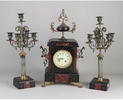 Antique French black marble clock.&nbsp;Circa 1880. Eight-day movement, half-hour strike and spring pendulum.&nbsp;Damage to 