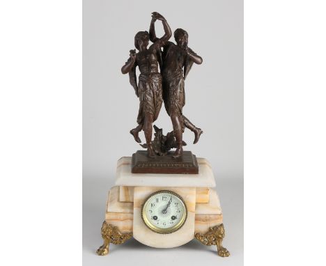 Antique French alabaster mantel clock with dancing Oriental ladies.&nbsp;Circa 1900. Composition metal.&nbsp;One leg has a te