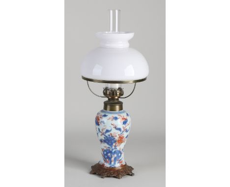 Antique table lamp with 18th century Chinese porcelain.&nbsp;Was a kerosene lamp, later electrified.&nbsp;Dimensions: H 30 cm