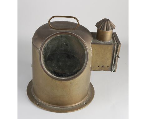Antique brass ship's compass with original small kerosene lamp.&nbsp;Circa 1920. Dimensions: 32 x 30 x Ø 23 cm.&nbsp;In good 