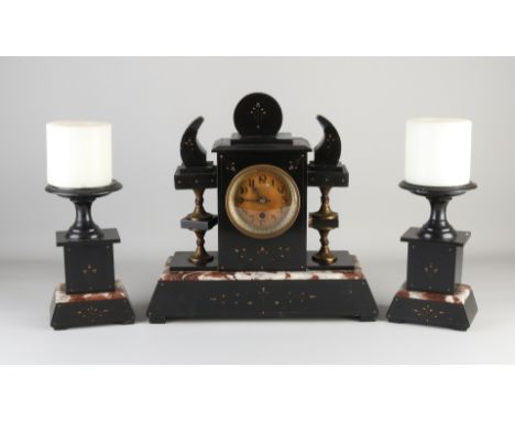 Three-piece antique French black marble clock set with coupes.&nbsp;Circa 1890. Eight-day movement, half-hour strike, spring 