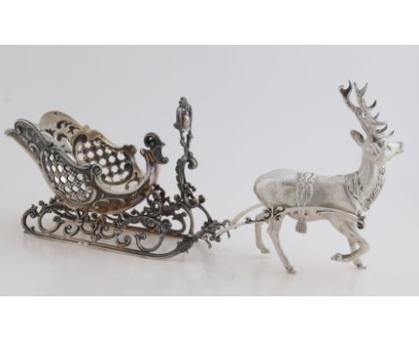 Beautiful silver sleigh with reindeer, 835/000, sleigh, openwork decorated with grid decor and curls, placed on a sled with s