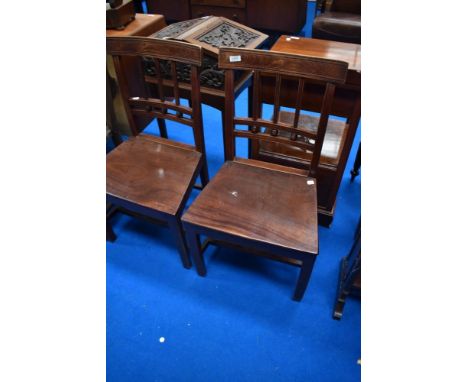 A pair of 19th Century mahogany rail back hall or dining chairs having rail and bobbin backs