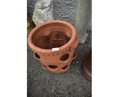 A terracotta strawberry planter