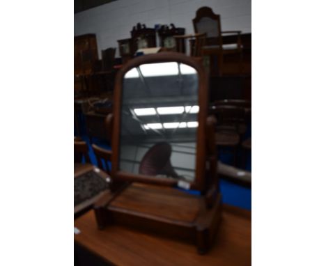 A Victorian mahogany toilet mirror having drawer base