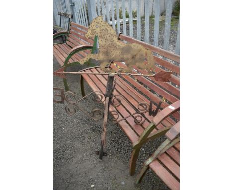 A metal weather vane, modelled as a horse