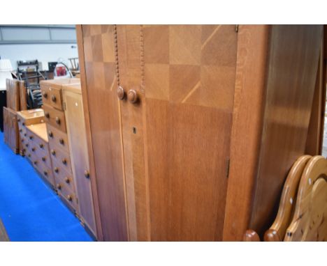 An impressive Art Deco golden oak bedrom suite comprising wardobe , narrow robe, high chest, low chest, dressing table with c