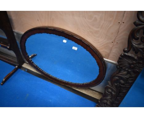 An early 20th Century mahogany oval mirror