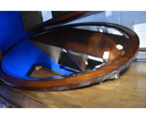 An early 20th Century mahogany frame oval wall mirror