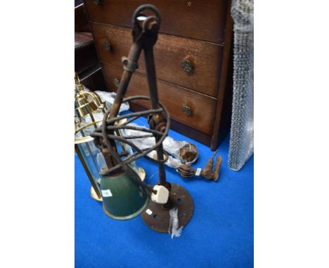 An industrial adjustable wall light fitting with base plate