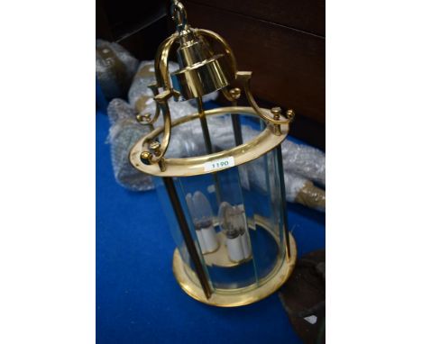A modern brass ceiling light