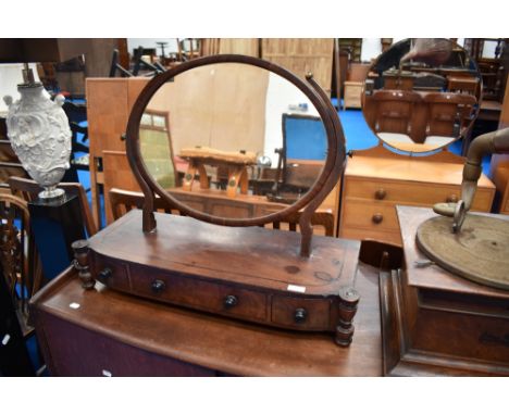 A 19th Century mahogany toilet mirror having drawer base