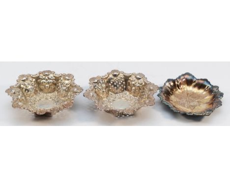 An Edwardian silver pair of bon bon dishes, Birmingham 1909, diameter9cm and a silver leaf dish, by Mappin &amp; Webb, Birmin