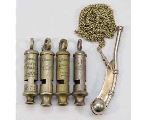 Four Metropolitan whistles, ARP, City Police, Police and broad arrow, together with a bosun's whistle. 