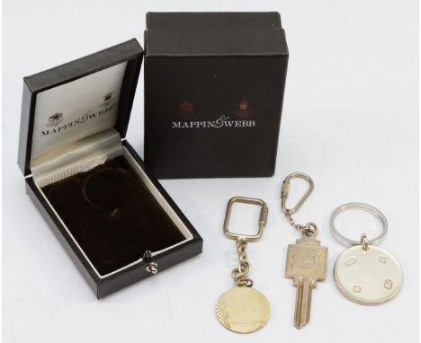 A silver disc key ring, by Mappin &amp; Webb, Sheffield 1997, case and two other silver key rings, 77gm 