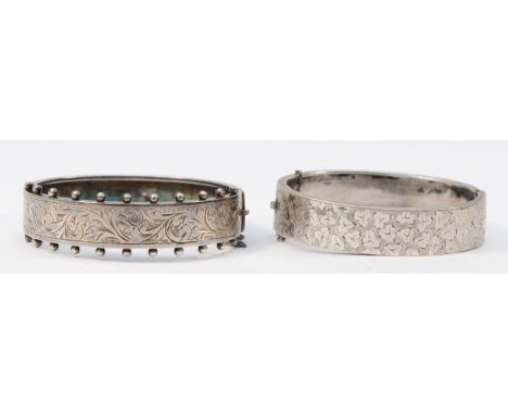 A Victorian style silver hinged bangle, Chester 1952, bead border, 58 x 50mm and a Victorian Sterling Silver example, 37gm 