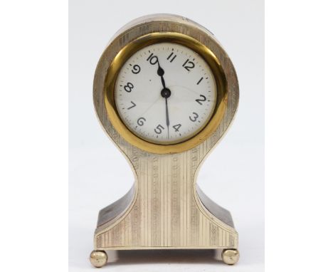 A silver mounted balloon mantel clock, Birmingham 1925, with engine turned decoration, 12.5cm, movement working when catalogu