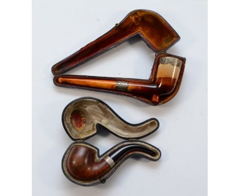 A Victorian silver mounted Meerschaum and amber pipe, Birmingham 1893, case and another silver mounted pipe in case. 