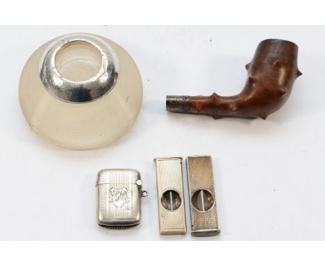 A silver vesta case, Birmingham 1905, a silver mounted glass match striker, two silver cigar piercers and a silver mounted pi