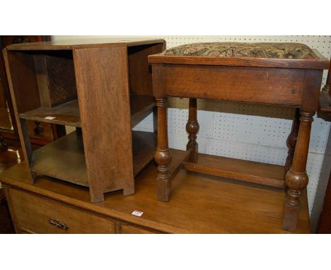 A 1930s oak octagonal tiered book table, h.51cm, w.50cm; together with a 1930s oak and tapestry upholstered padseat hinge top