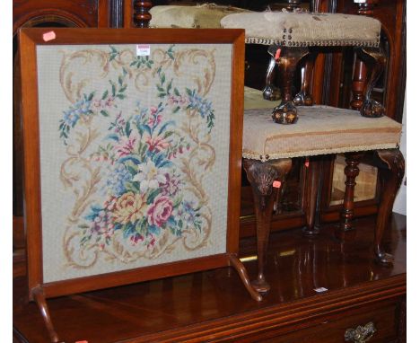 Two early 20th century mahogany and needlework dressing stools, raised on cabriole supports, together with a similar low fire