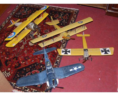 Four various large-scale static display model aircraft 