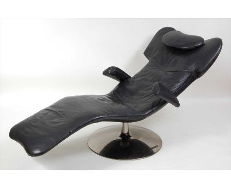 A contemporary Natuzzi black leather upholstered swivel day-bed, raised on polished chrome circular domed support, with remov