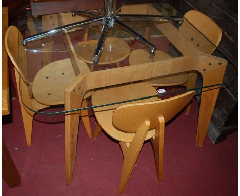 A contemporary breakfast suite, comprising; heavy glass topped round cornered table on plywood base, with four matching plywo