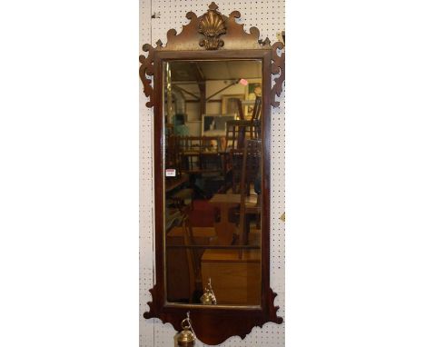 A circa 1900 mahogany Chippendale style fret-carved rectangular wall mirror, of good size, having a raised gilt decorated upp