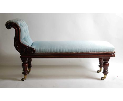 A William IV mahogany framed day-bed, the whole re-upholstered in a buttonback blue silk damask, having a leaf carved showfra