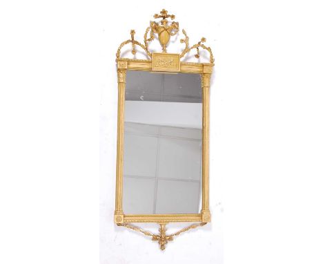 A late 18th century giltwood and gesso wall mirror, having a central urn and entwined foliate cresting above a rectangular mi