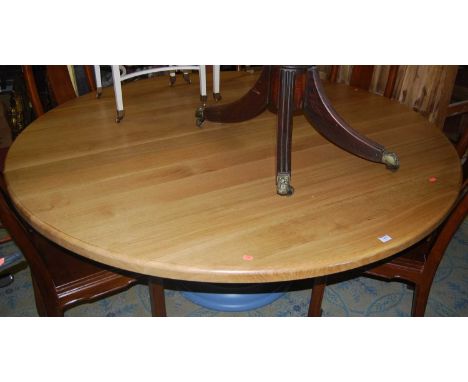 A large contemporary light oak topped circular dining table, raised on blue painted turned pedestal support, dia.180cm 