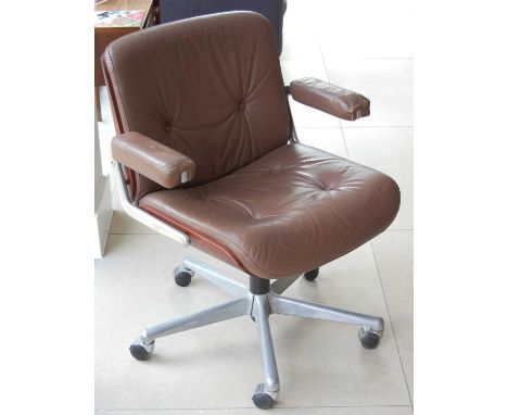 Gordon Russell - a 1960s brushed aluminium, plywood and tan leather upholstered swivel desk elbow chair, raised on roller cas
