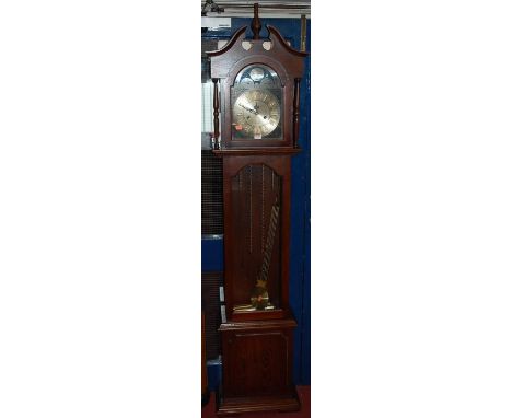 A contemporary Lincoln oak 31-day longcase clock, having an arched dial, glazed trunk door, twin faux weights and pendulum, h