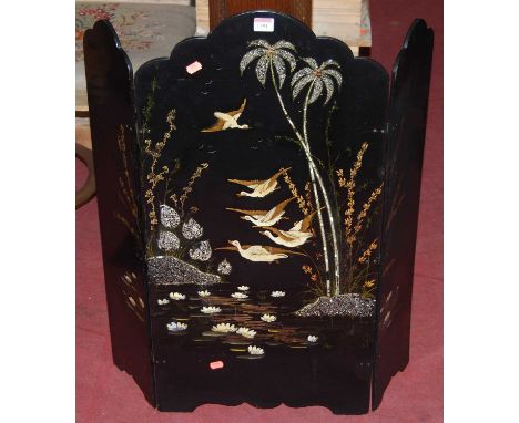 An early 20th century black lacquered low triptych screen, mother of pearl, gilt, and polychrome painted, h.84cm, w.77cm