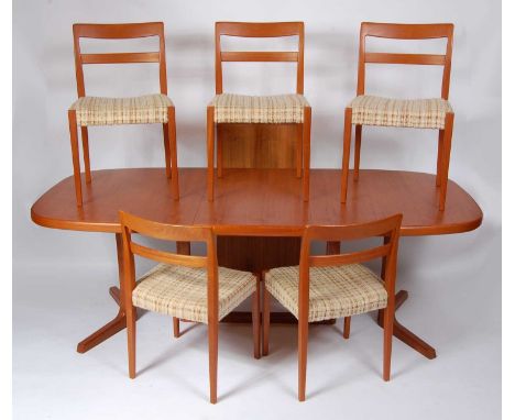 Svend Madsen - a 1960s Danish teak dining suite, comprising; extending dining table with rounded D-ends, having pull-out acti