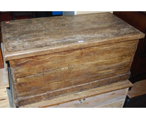 A rustic scrumble-finished pine hinge topped tool chest, having iron end carry handles, w.92.5cm