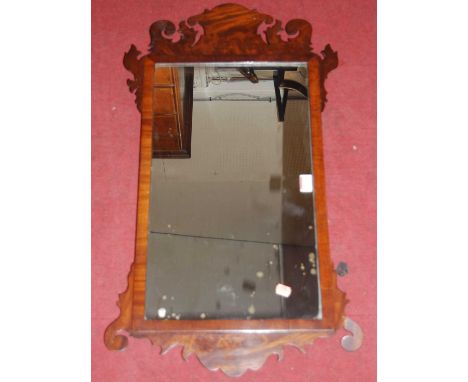 A 19th century mahogany fret carved rectangular wall mirror in the Chippendale taste, 81 x 45cmCondition report: Some damage 
