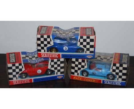 Three various boxed Scalextric slot-racing cars, to include an Aston Martin GT without lightsCondition report: C77 Ford GT in