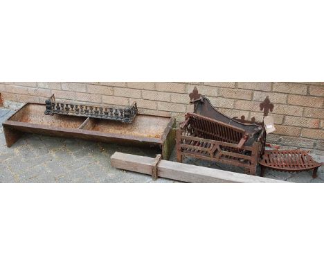 A cast iron fire basket, with two sundry fire grates, a similar stand, twin feeding trough, and a small fender (6)
