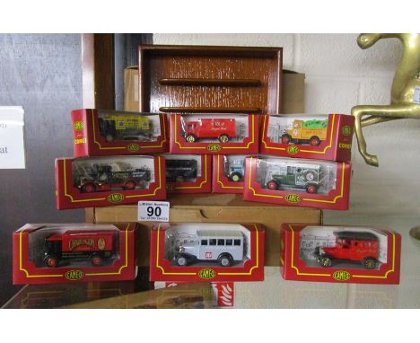 Collection of die-cast vintage advertising vehicles in un-opened boxes with display case