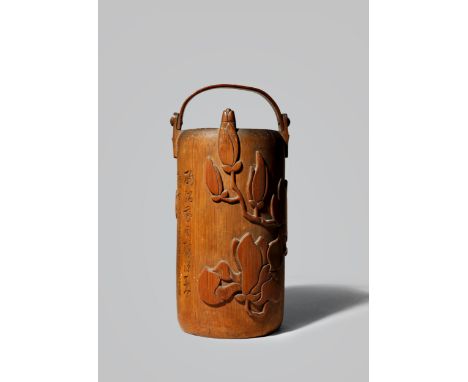 AN UNUSUAL JAPANESE BAMBOO SAKE BOTTLE, TOKURI MEIJI 1868-1912 Modelled as a cylindrical water bucket and carved with magnoli