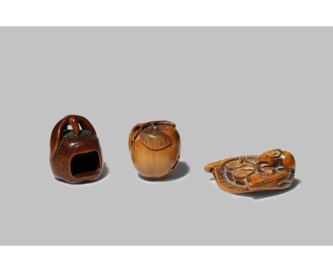 THREE JAPANESE NETSUKE EDO/MEIJI PERIODS Two carved as biwa fruits, one hollow and the other with simulated insect damage, th