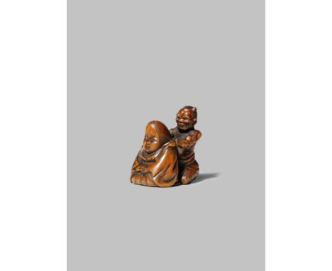 A JAPANESE WOOD NETSUKE EDO/MEIJI PERIOD Carved as an oni giving Okame a massage, the demon typically depicted with two short